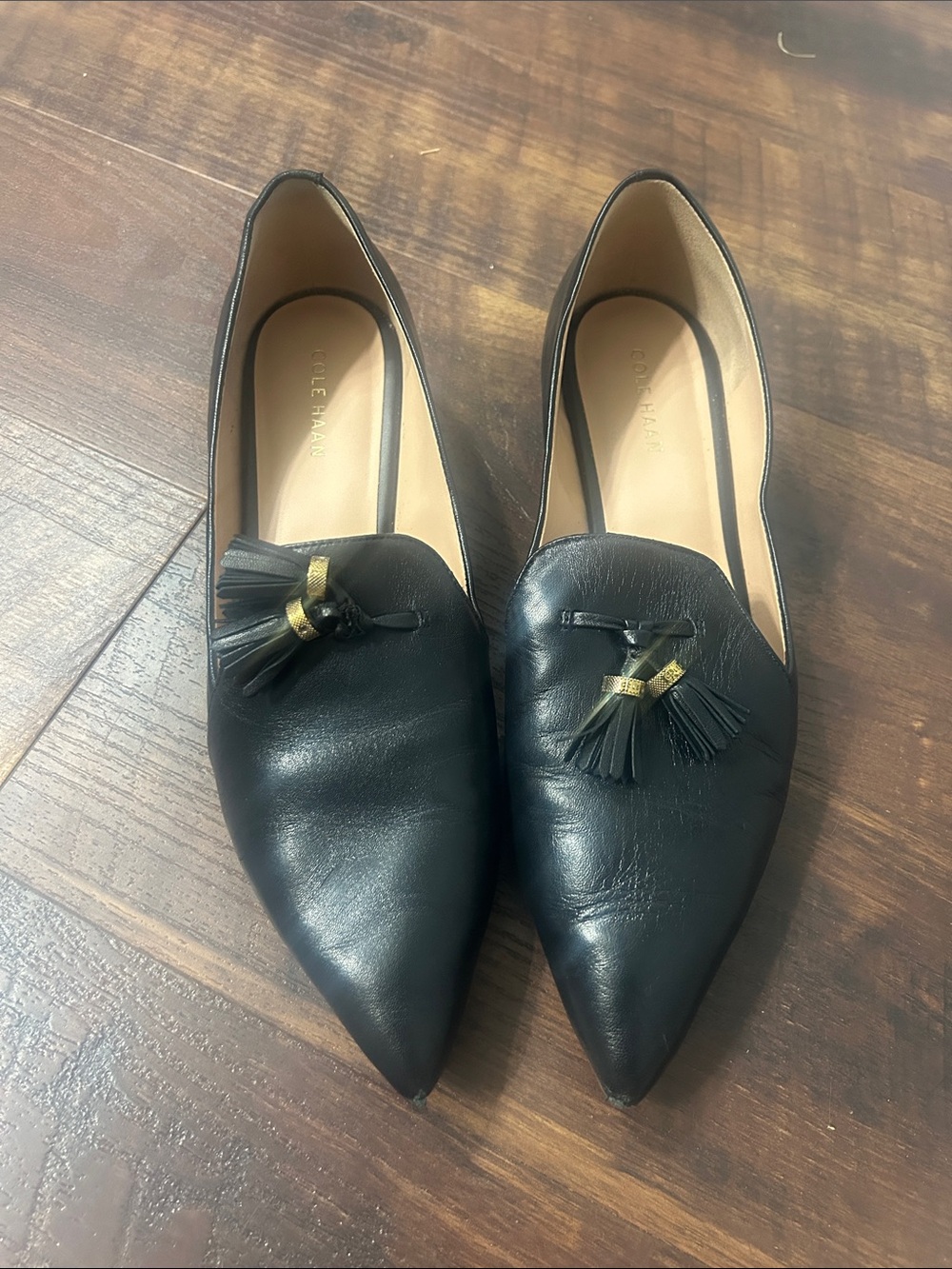 Cole Haan Black Pointed Tassel Loafers with Gold Accent